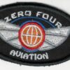 Zero Four Aviation Sew-On Patch Elevate your pilot jacket or flight suit with this high-quality, authentic Zero Four Aviation sew-on patch. Crafted with precision and attention to detail, this patch is a must-have for any aviation enthusiast. Key Features: Unique Design: Showcases the distinctive Zero Four Aviation logo in a stylish and eye-catching design. Durable Construction: Made from top-grade materials to withstand the rigors of flight and frequent wear. Easy to Apply: Features a strong backing for simple and secure sewing attachment to your garment. Versatile: Suitable for a variety of aviation-themed apparel, including pilot jackets, flight suits, and caps. Express Your Passion for Aviation Whether you're a seasoned pilot or simply admire the world of aviation, this Zero Four Aviation sew-on patch is the perfect way to show your love for the sky. Add a touch of personality and style to your flight gear and let the world know that you're a true aviation enthusiast. Don't miss out on this opportunity to own a piece of aviation history. Order your Zero Four Aviation sew-on patch today!