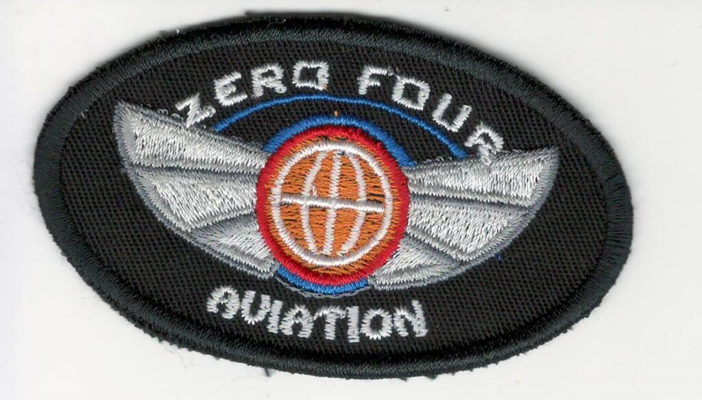 Zero Four Aviation Sew-On Patch Elevate your pilot jacket or flight suit with this high-quality, authentic Zero Four Aviation sew-on patch. Crafted with precision and attention to detail, this patch is a must-have for any aviation enthusiast. Key Features: Unique Design: Showcases the distinctive Zero Four Aviation logo in a stylish and eye-catching design. Durable Construction: Made from top-grade materials to withstand the rigors of flight and frequent wear. Easy to Apply: Features a strong backing for simple and secure sewing attachment to your garment. Versatile: Suitable for a variety of aviation-themed apparel, including pilot jackets, flight suits, and caps. Express Your Passion for Aviation Whether you're a seasoned pilot or simply admire the world of aviation, this Zero Four Aviation sew-on patch is the perfect way to show your love for the sky. Add a touch of personality and style to your flight gear and let the world know that you're a true aviation enthusiast. Don't miss out on this opportunity to own a piece of aviation history. Order your Zero Four Aviation sew-on patch today!